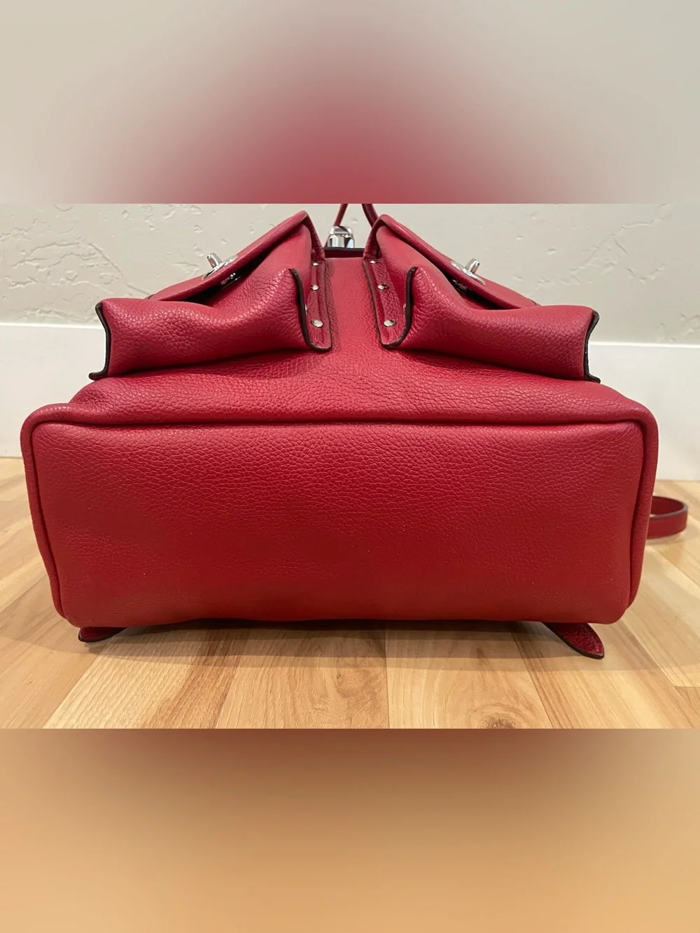 Coach EUC Red Pebble Leather Turnlock Backpack with stud pocket detail. ♥️ ❤️